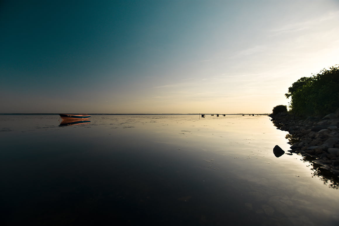 piątkowski kamil interfoto łódź zachód słońca nad jeziorem